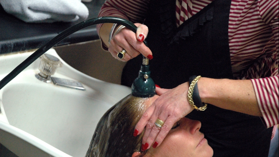 woman getting hair washed at a salon